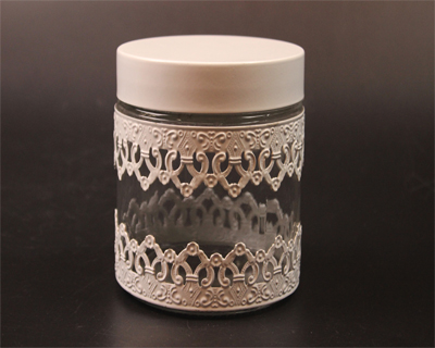 glass stroage jar with metal overlay