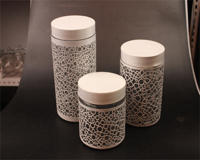 glass stroage jar with metal overlay